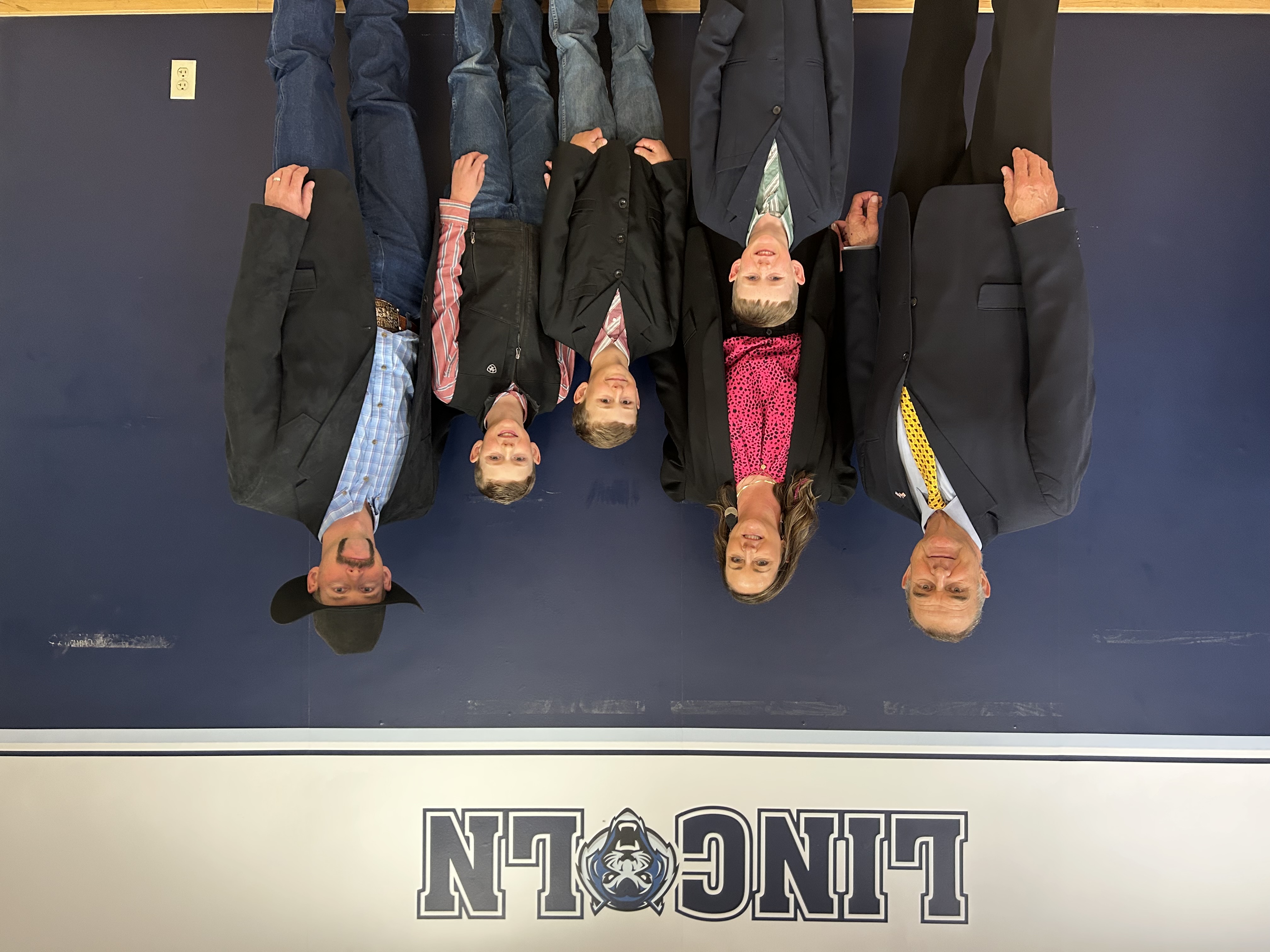 Megan Titus stands with her husband, three sons and Missouri governor Mike Kehoe. 