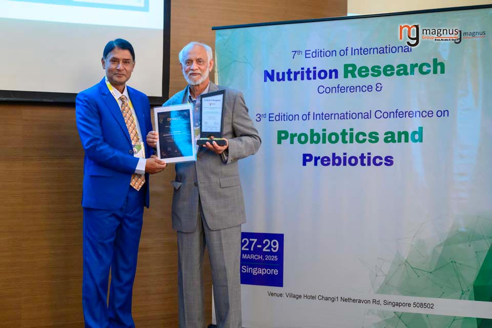 Dr. Safiullah Pathan, right, accepts a certificate of recognition after delivering a keynote presentation at the 7th International Nutrition Research Conference.